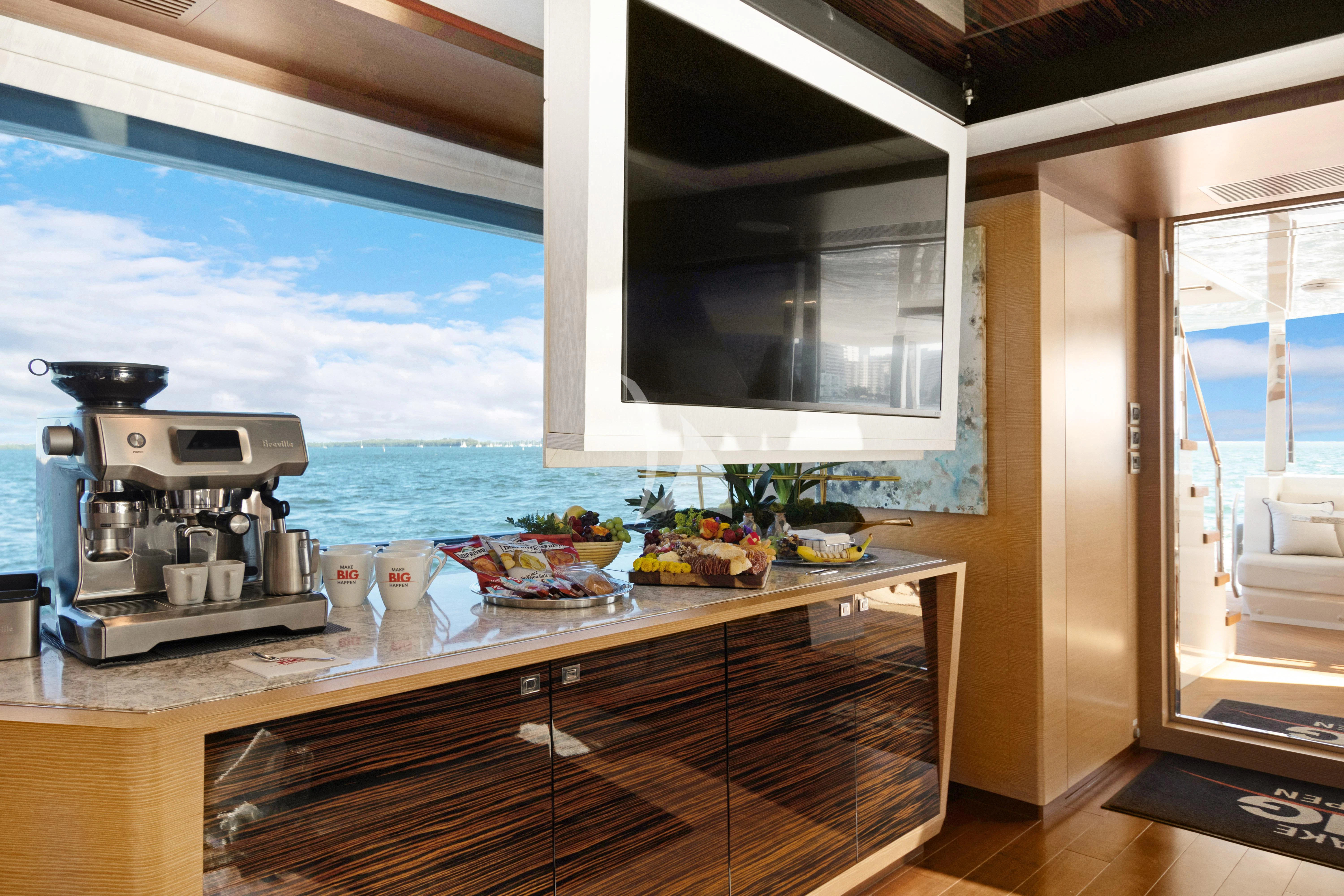 a kitchen with a large window aboard MAKE BIG HAPPEN Yacht for Sale
