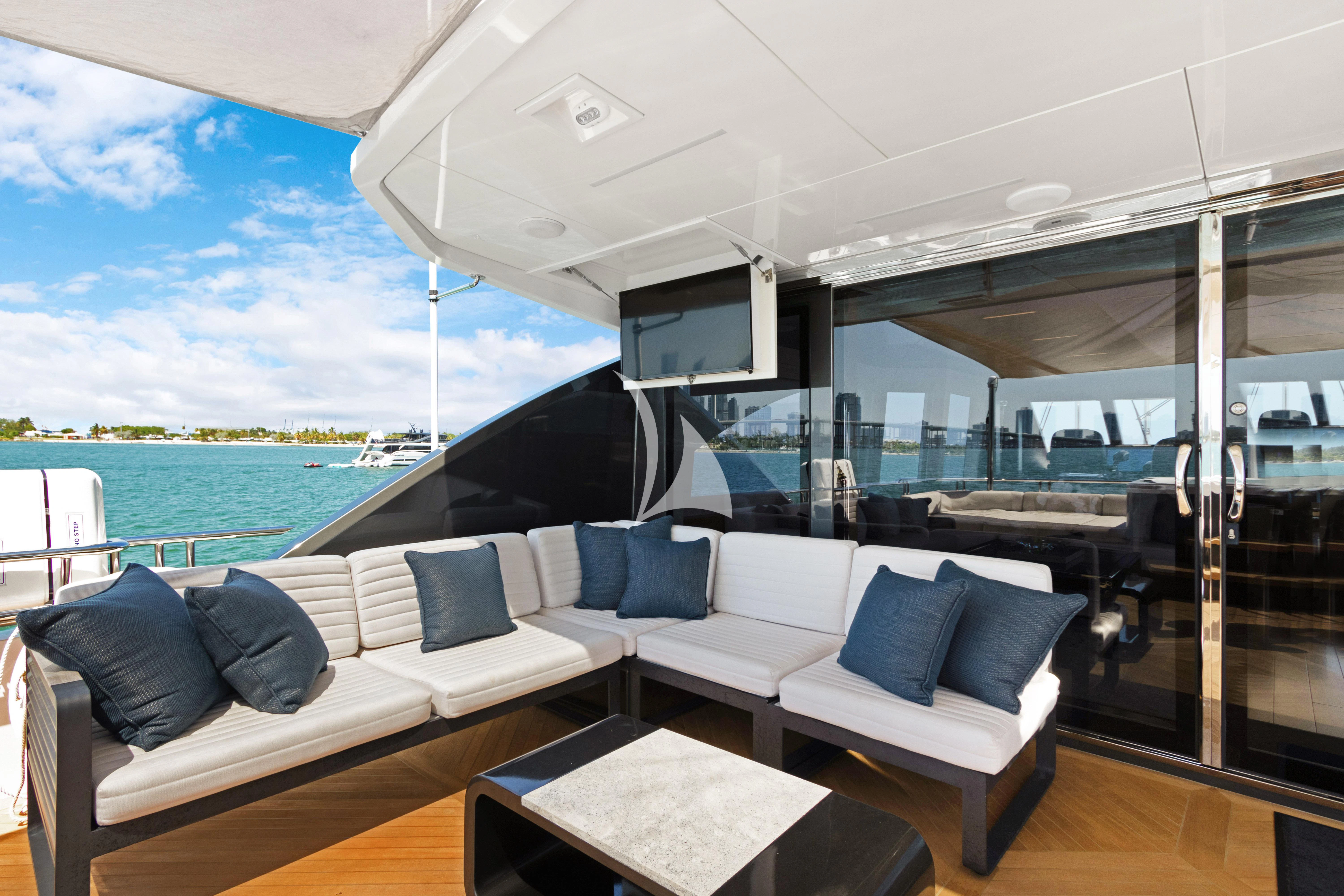 a room with a couch and a pool aboard MAKE BIG HAPPEN Yacht for Sale