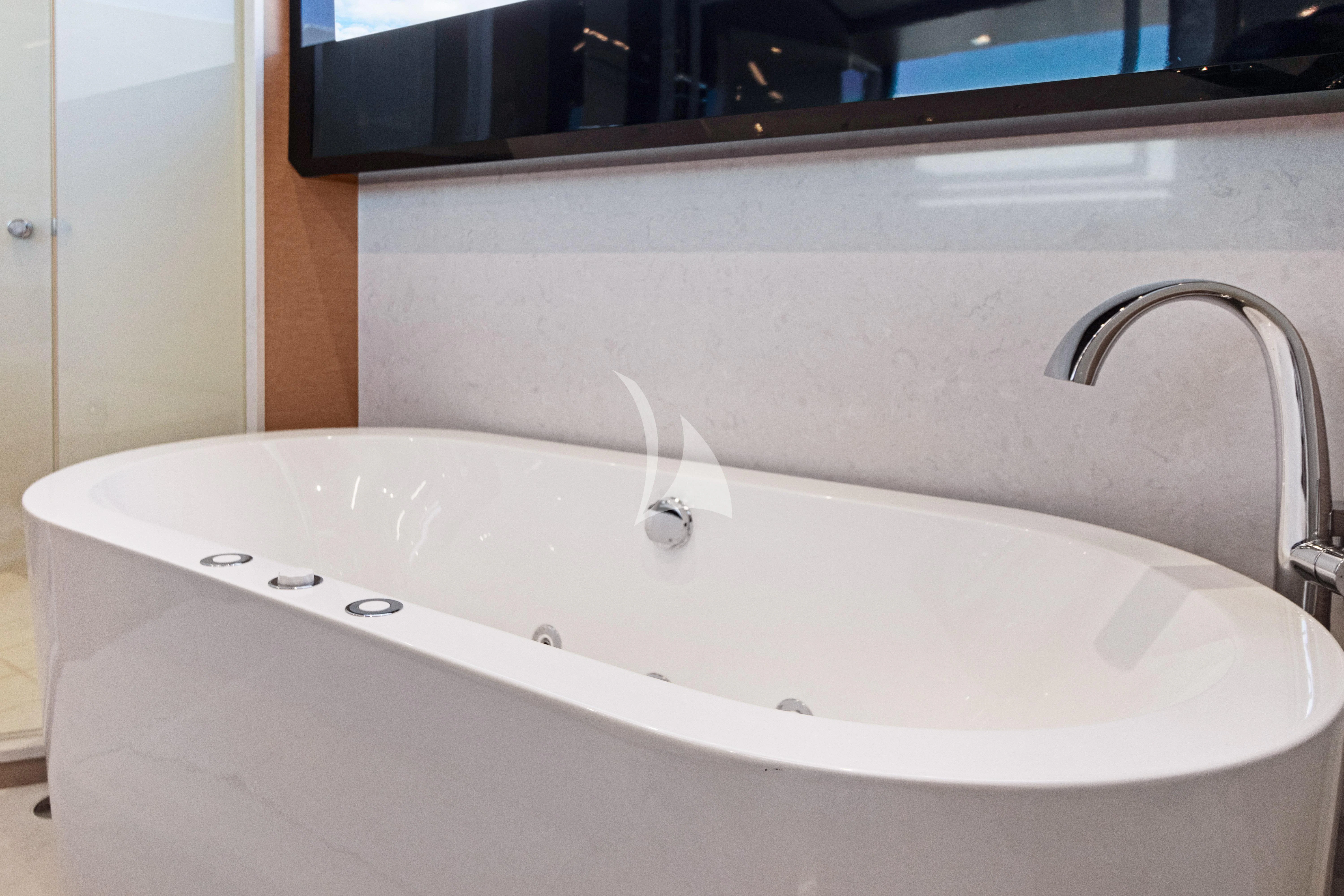 a bathtub with a faucet aboard MAKE BIG HAPPEN Yacht for Sale