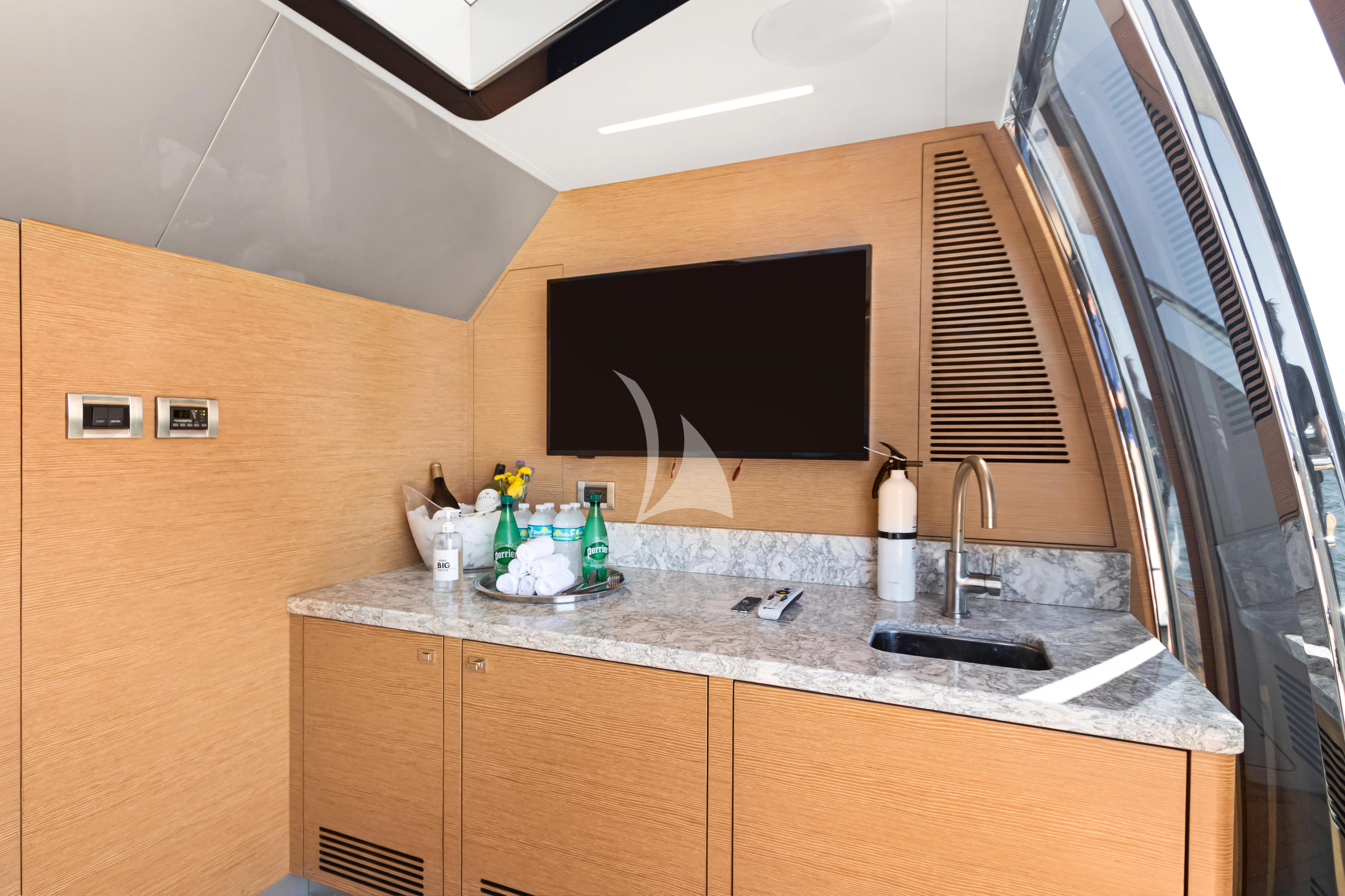 a kitchen with a marble counter top aboard MAKE BIG HAPPEN Yacht for Sale