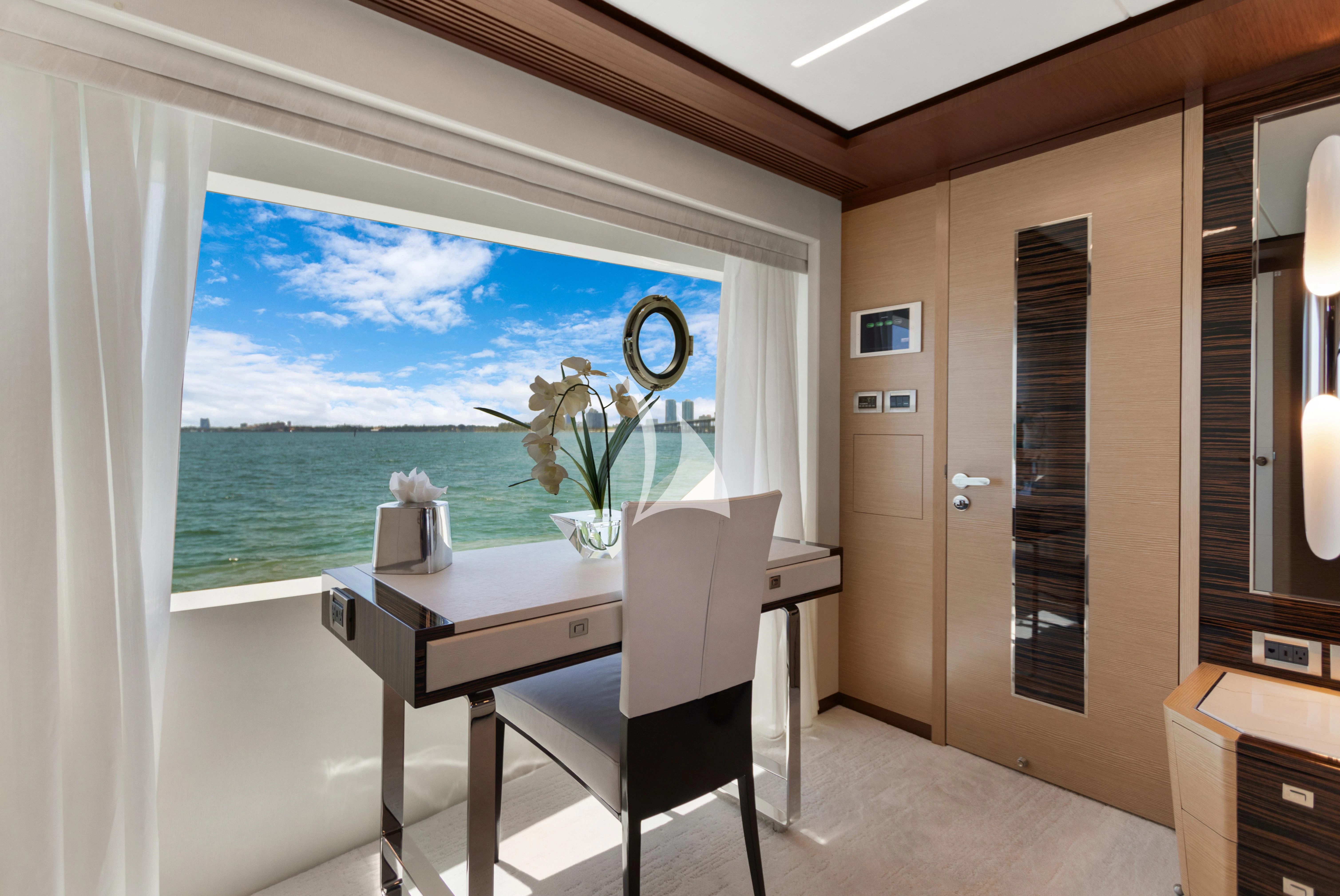 a room with a table and chairs aboard MAKE BIG HAPPEN Yacht for Sale