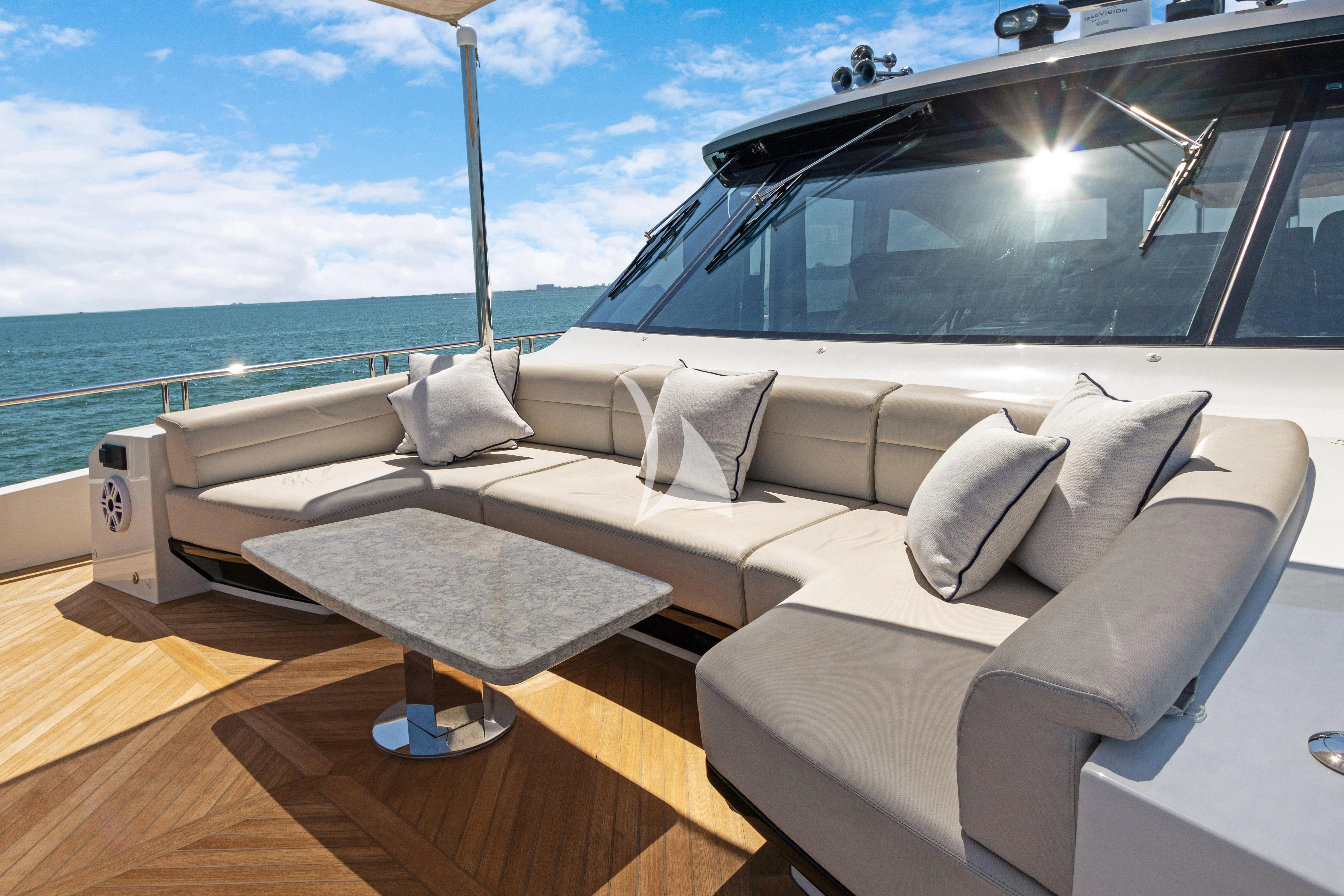 a room with a couch and a table on a boat aboard MAKE BIG HAPPEN Yacht for Sale