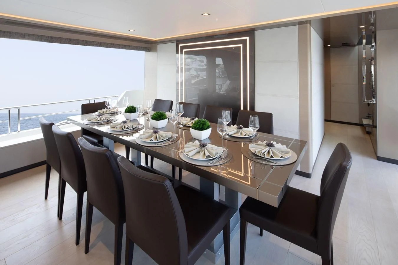 a dining table in a room aboard MAKE BIG HAPPEN Yacht for Sale