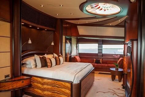 a room with a bed and a window aboard USHER Yacht for Sale