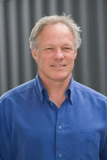 a man smiling for the picture aboard USHER Yacht for Sale