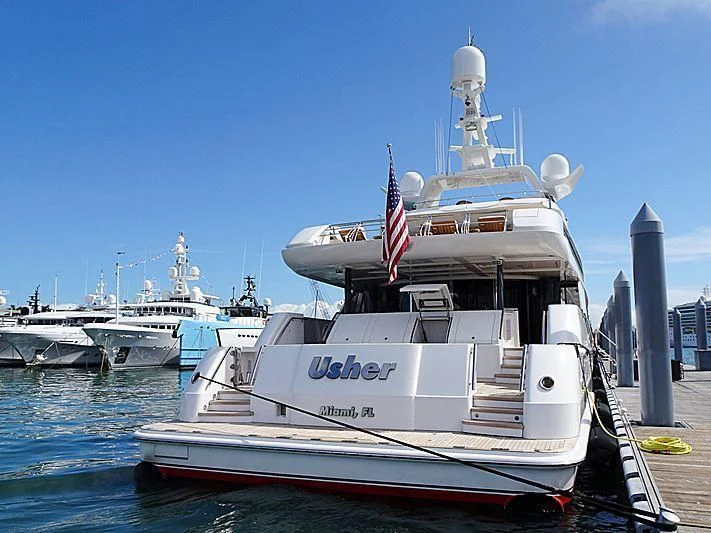 a large ship docked at a port aboard USHER Yacht for Sale