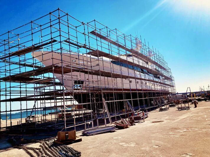 a large building with a large spiral staircase aboard USHER Yacht for Sale