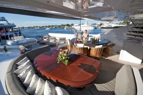 a room with a table and chairs aboard USHER Yacht for Sale