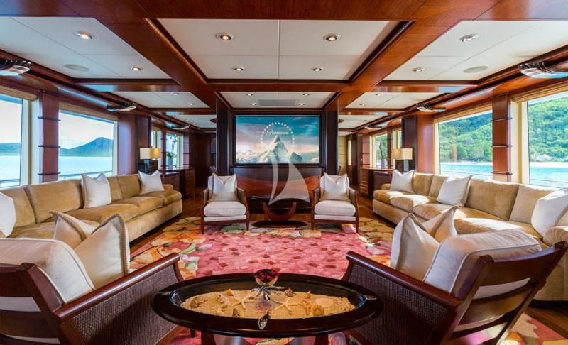 a living room with a large screen aboard USHER Yacht for Sale