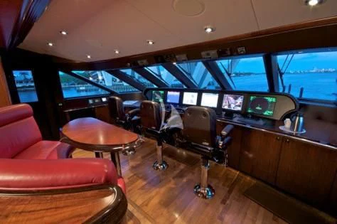 a room with a table and chairs aboard USHER Yacht for Sale