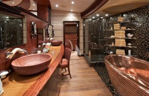 a bathroom with a large marble counter aboard USHER Yacht for Sale