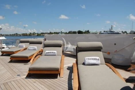 a deck with a view of a city and water aboard USHER Yacht for Sale