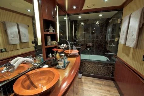 a bathroom with a sink and a shower aboard USHER Yacht for Sale