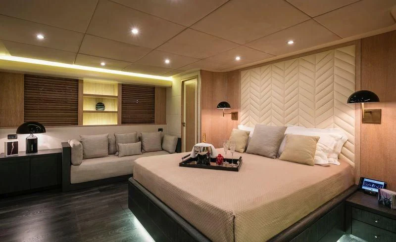 a large bedroom with a large bed aboard SAINT Yacht for Sale