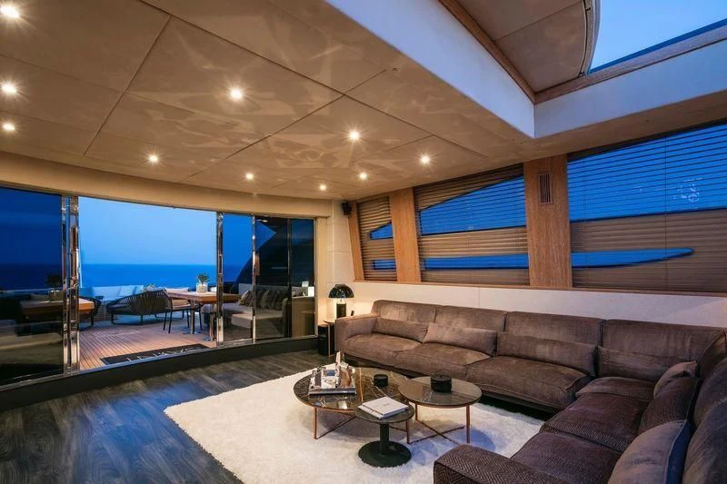 a living room with a large glass wall aboard SAINT Yacht for Sale