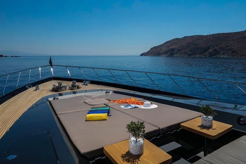 a table with food on it by the water aboard SAINT Yacht for Sale