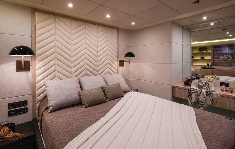 a bed with a white sheet aboard SAINT Yacht for Sale