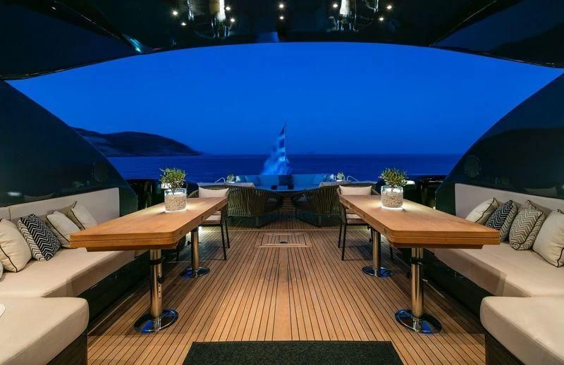 a room with a table and chairs aboard SAINT Yacht for Sale