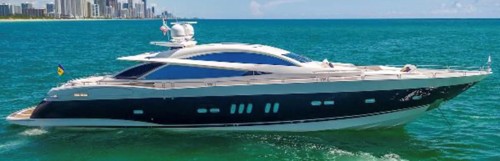 a black and white boat on the water aboard UNICO Yacht for Sale