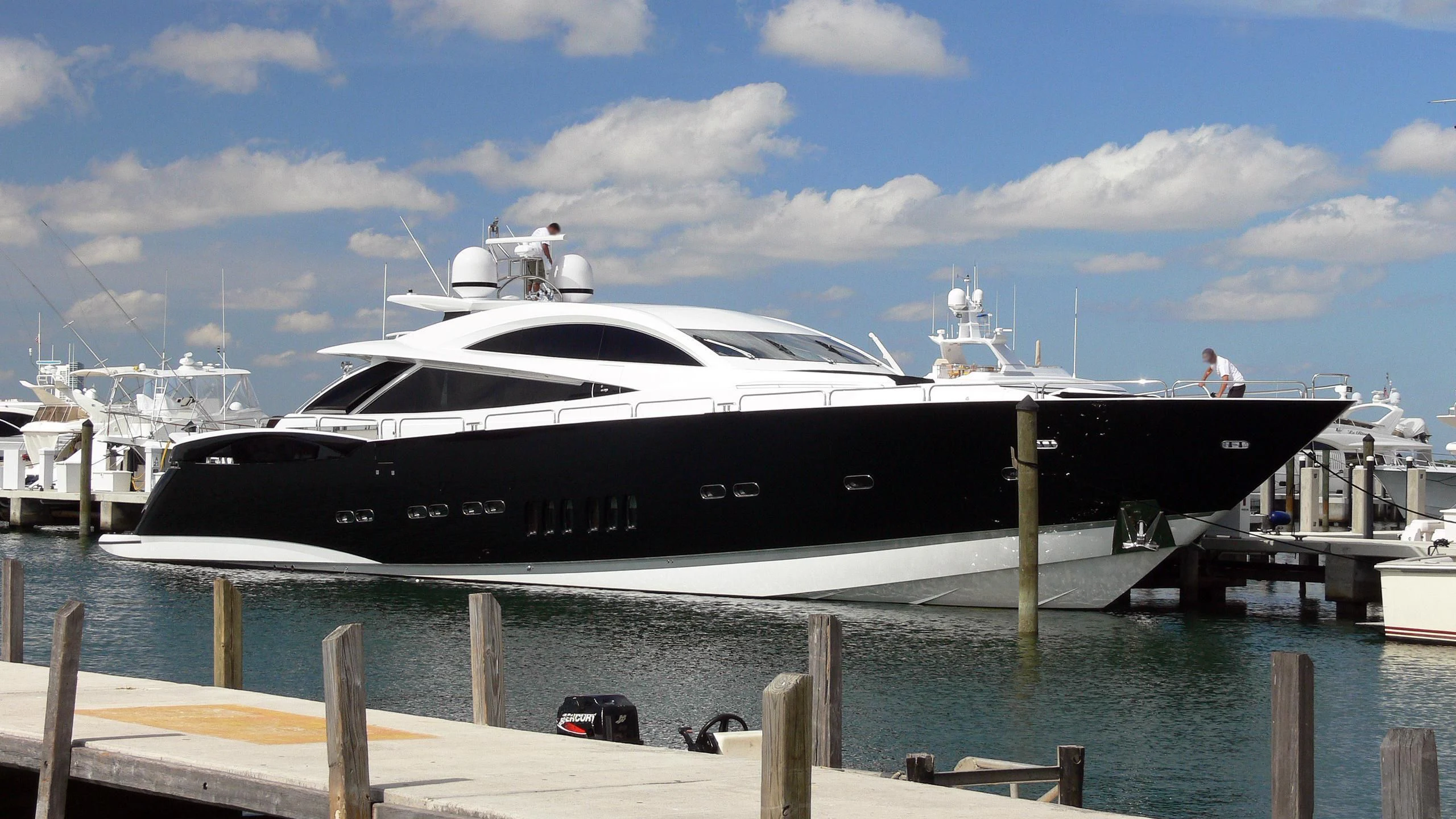 a yacht docked at a pier aboard UNICO Yacht for Sale