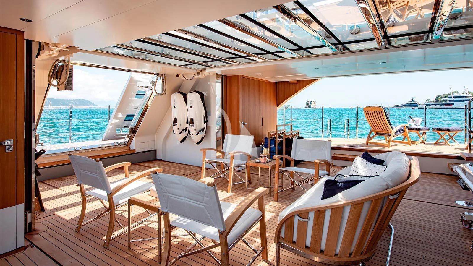 a boat with chairs and tables aboard LADY LENA Yacht for Sale