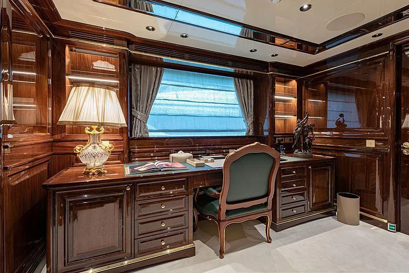 a room with a desk and a chair aboard LADY LENA Yacht for Sale