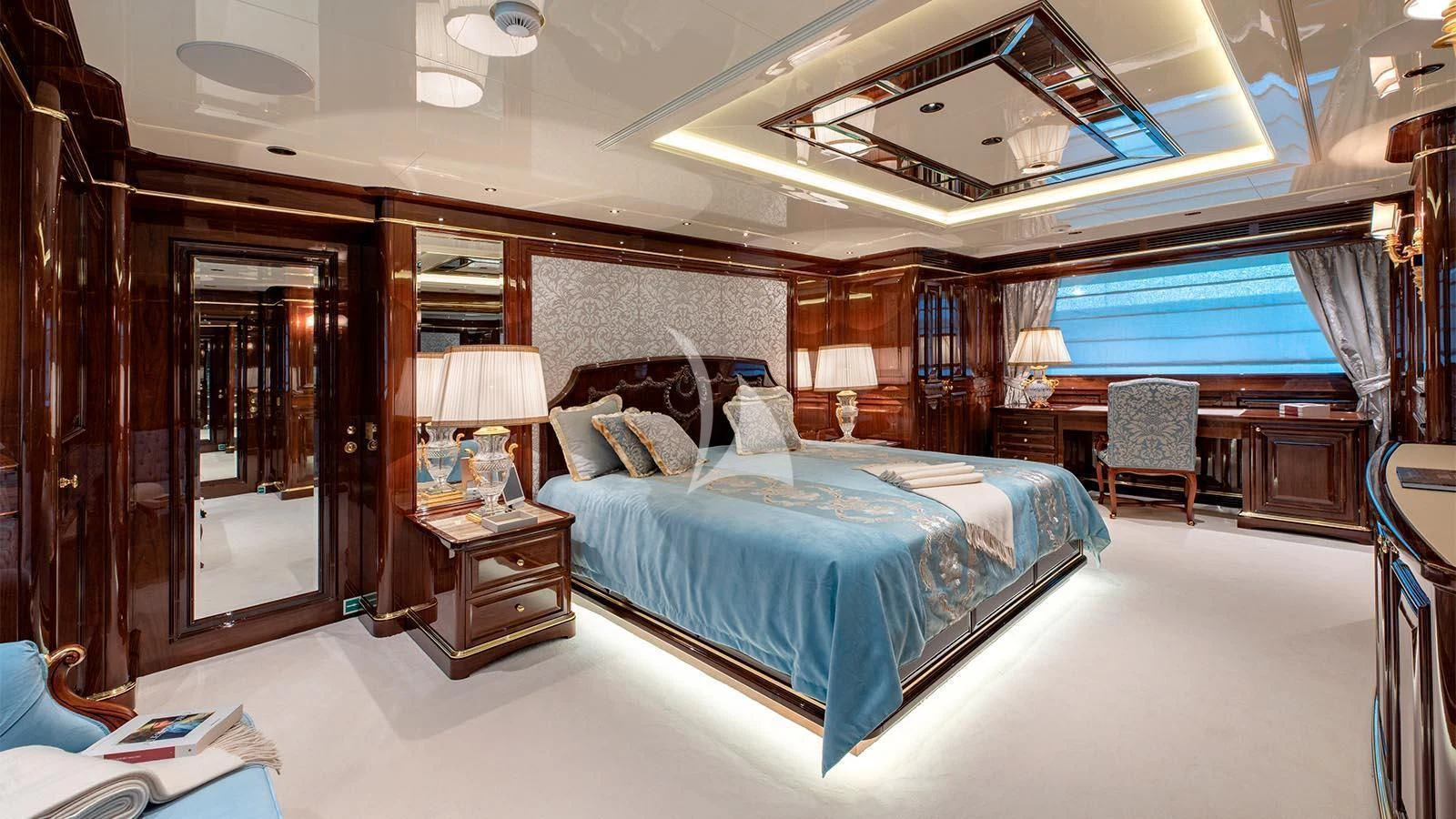a large bedroom with a large bed aboard LADY LENA Yacht for Sale