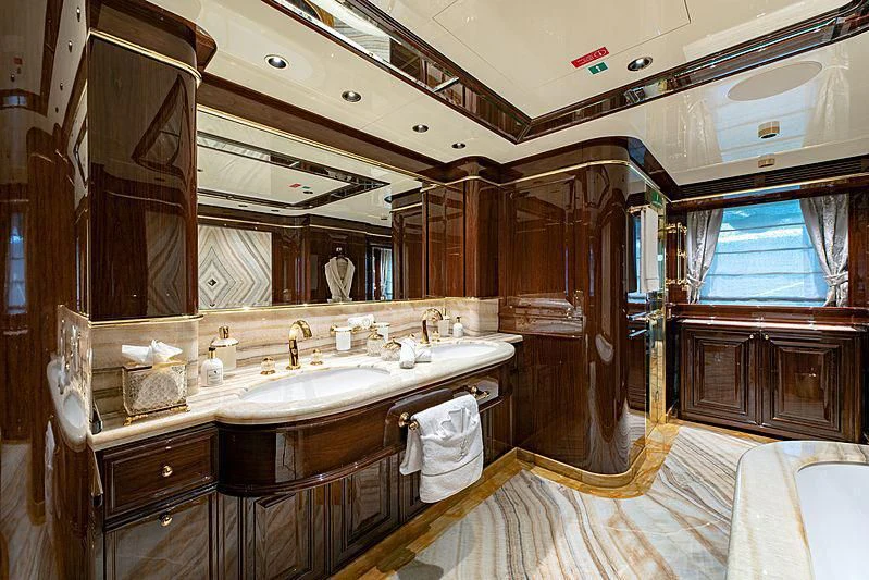 a bathroom with a large mirror aboard LADY LENA Yacht for Sale