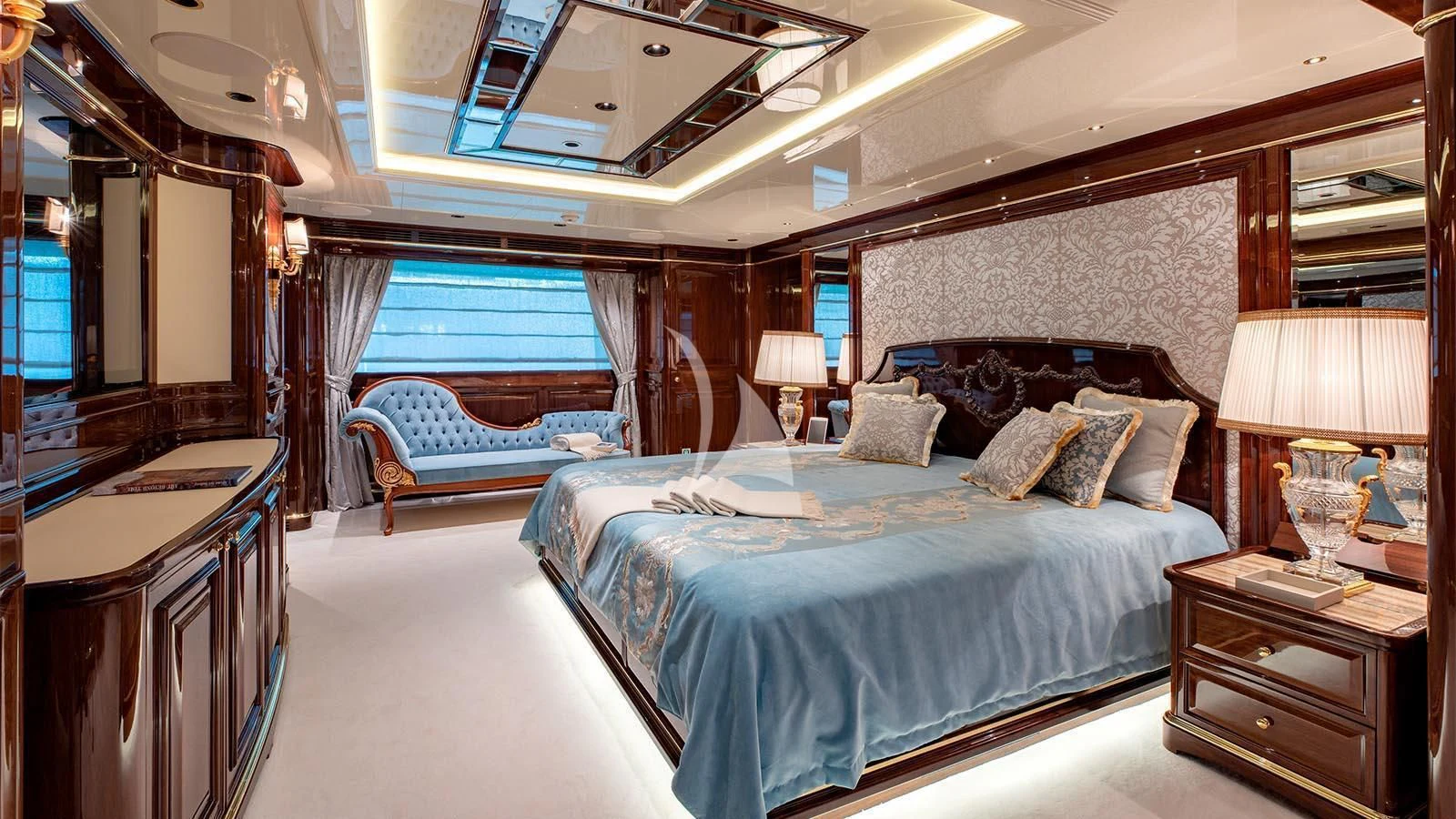 a bedroom with a bed and a window aboard LADY LENA Yacht for Sale