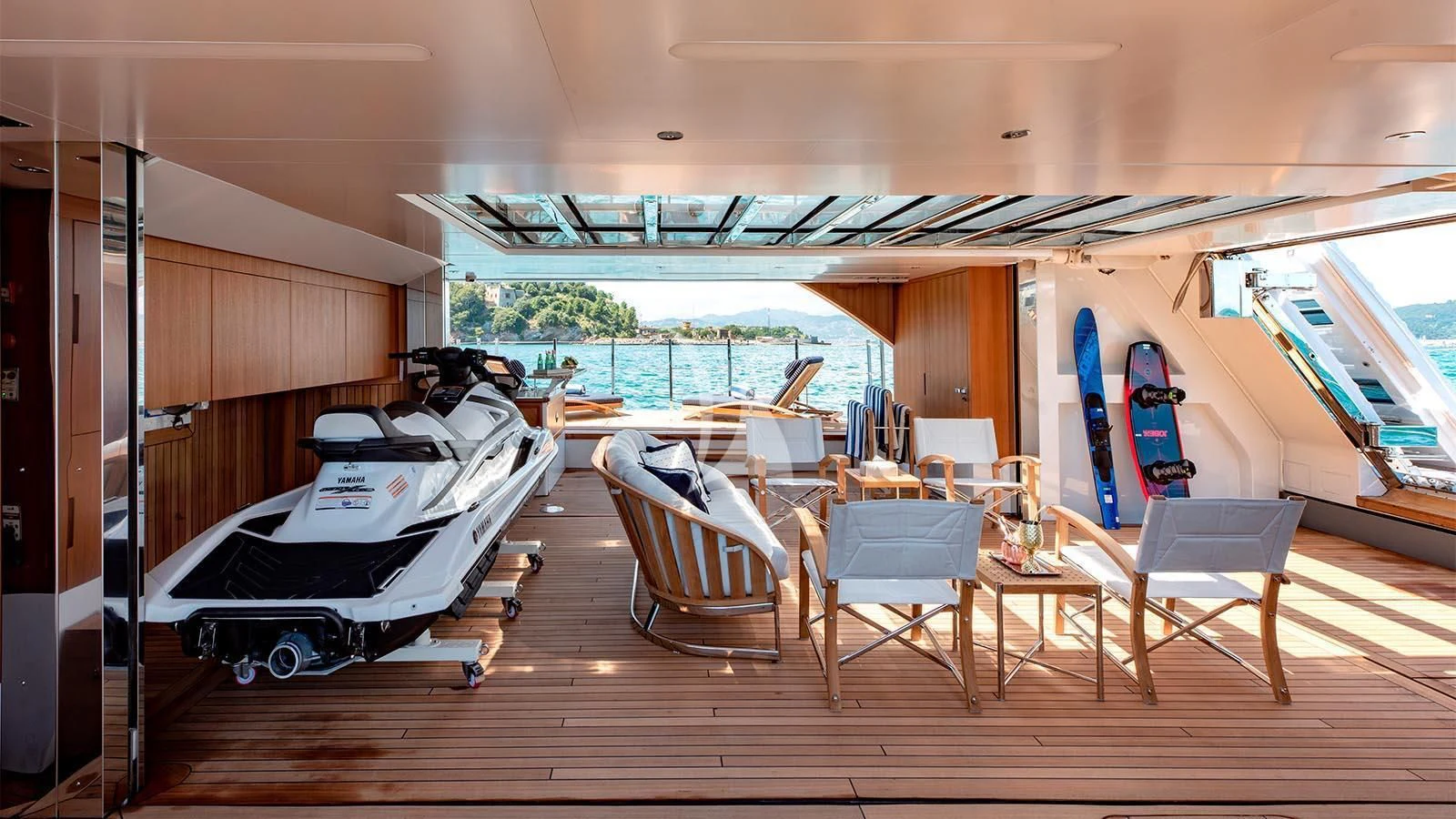 a room with a bed and chairs aboard LADY LENA Yacht for Sale