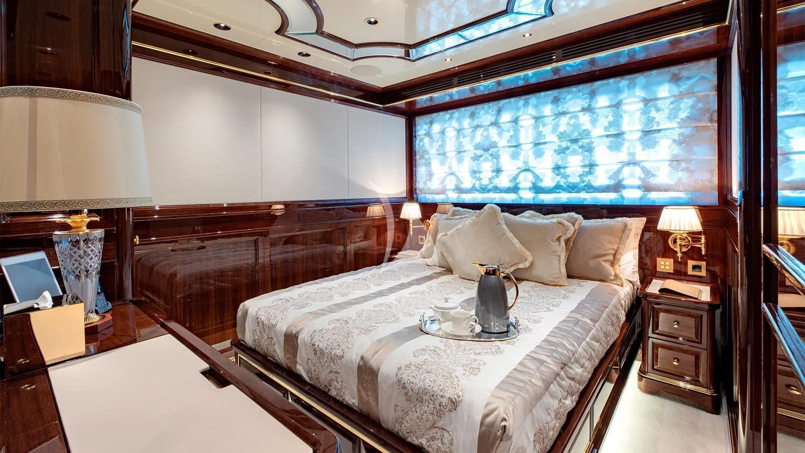 a large bedroom with a large bed aboard LADY LENA Yacht for Sale