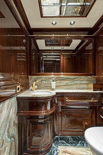 a bathroom with a sink and a mirror aboard LADY LENA Yacht for Sale