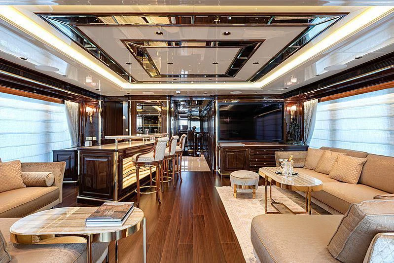 a living room with a wood floor aboard LADY LENA Yacht for Sale