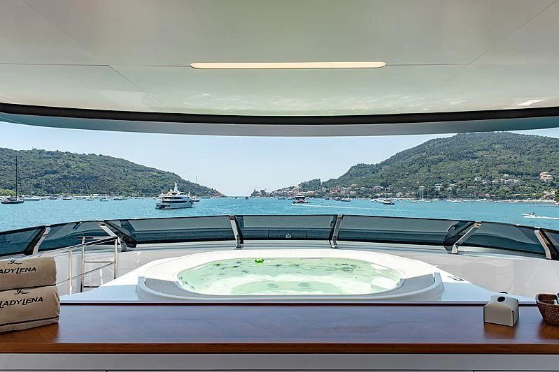 a white boat on a dock aboard LADY LENA Yacht for Sale