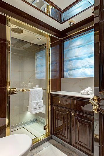 a bathroom with a large mirror aboard LADY LENA Yacht for Sale