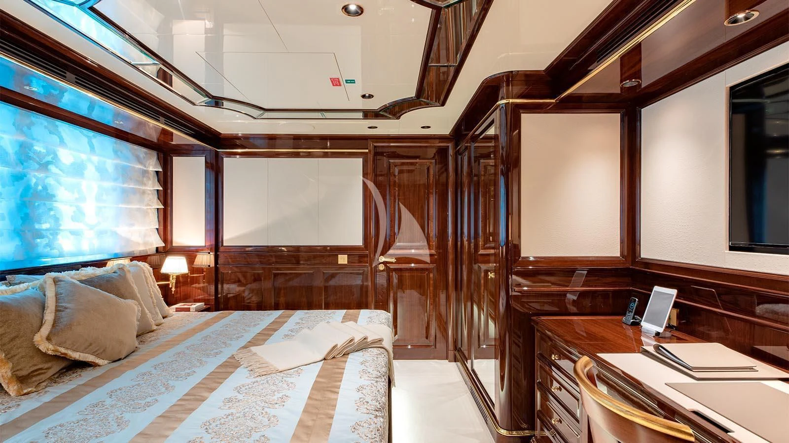 a room with a bed and a laptop aboard LADY LENA Yacht for Sale