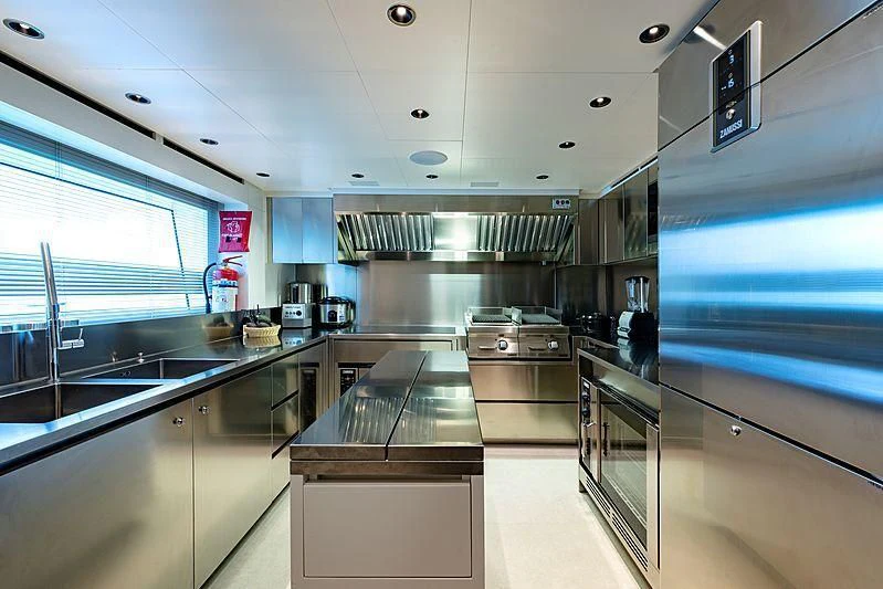 a kitchen with stainless steel appliances aboard LADY LENA Yacht for Sale