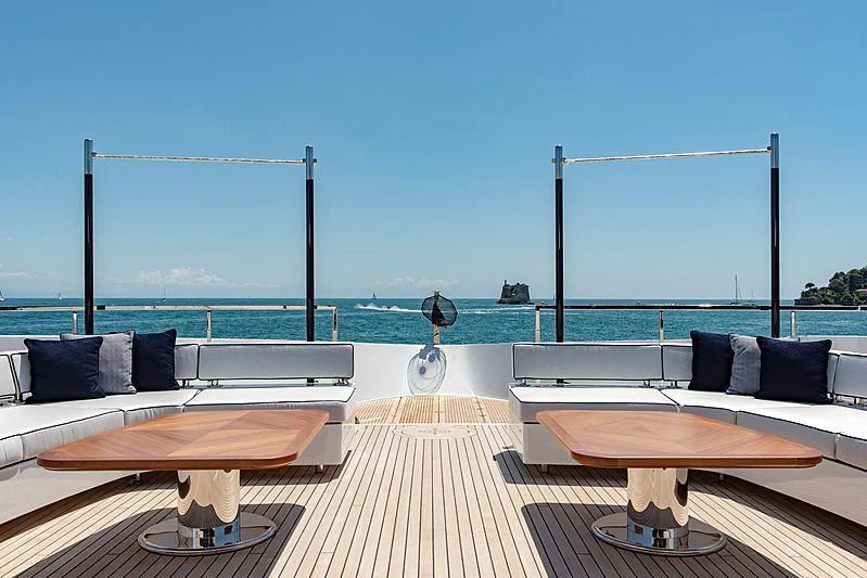a room with a table and chairs aboard LADY LENA Yacht for Sale