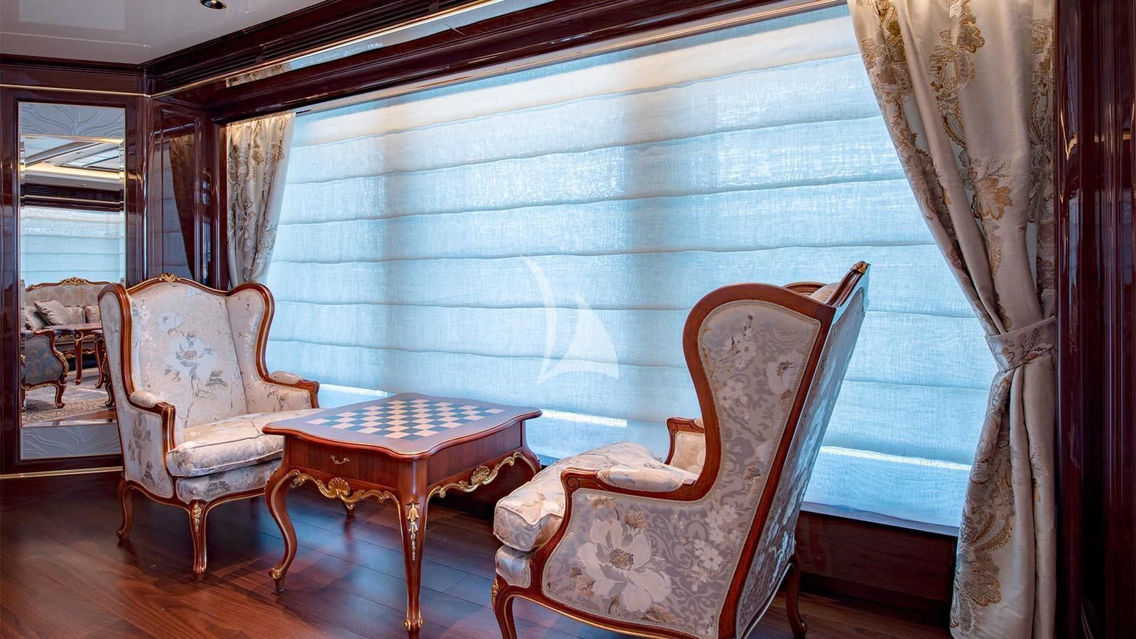 a room with chairs and a table aboard LADY LENA Yacht for Sale