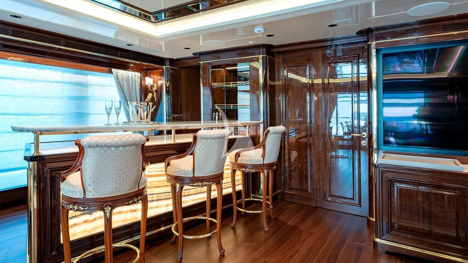 a room with chairs and a table aboard LADY LENA Yacht for Sale