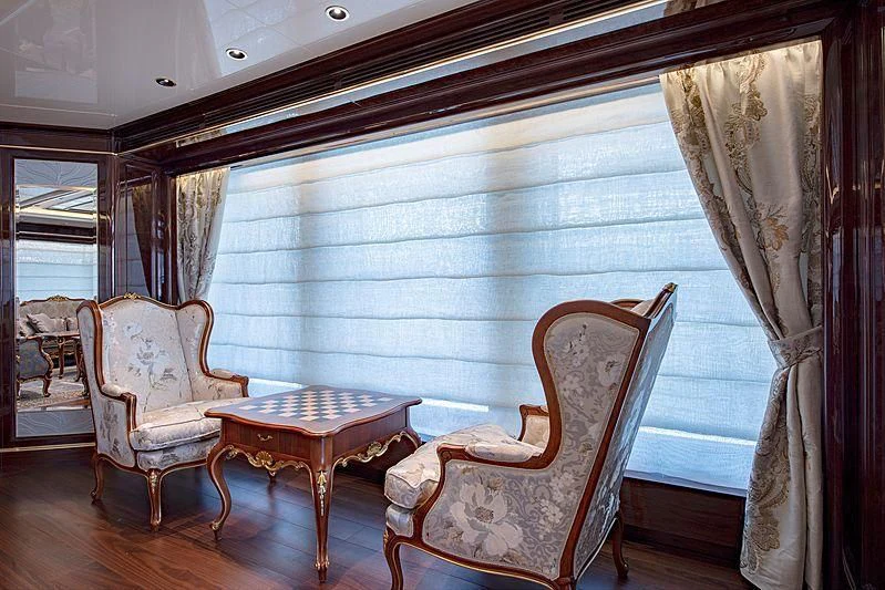 a room with chairs and a table aboard LADY LENA Yacht for Sale