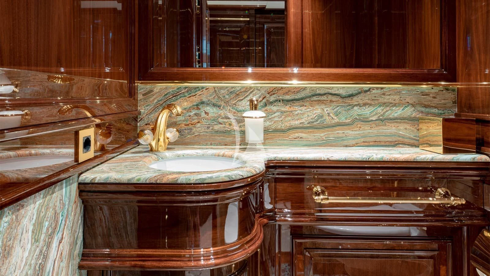 a bathroom with a sink and a mirror aboard LADY LENA Yacht for Sale