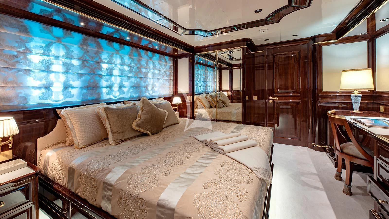 a large bed in a room aboard LADY LENA Yacht for Sale