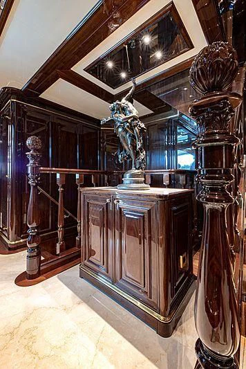 a room with a statue and a mirror aboard LADY LENA Yacht for Sale
