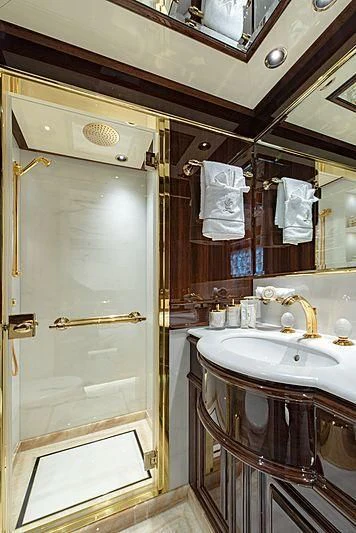 a bathroom with a sink and a mirror aboard LADY LENA Yacht for Sale