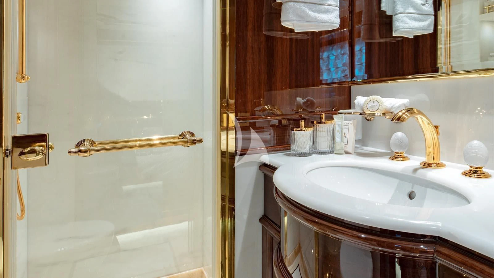 a bathroom with a sink and a mirror aboard LADY LENA Yacht for Sale