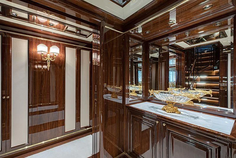 a room with wooden cabinets aboard LADY LENA Yacht for Sale
