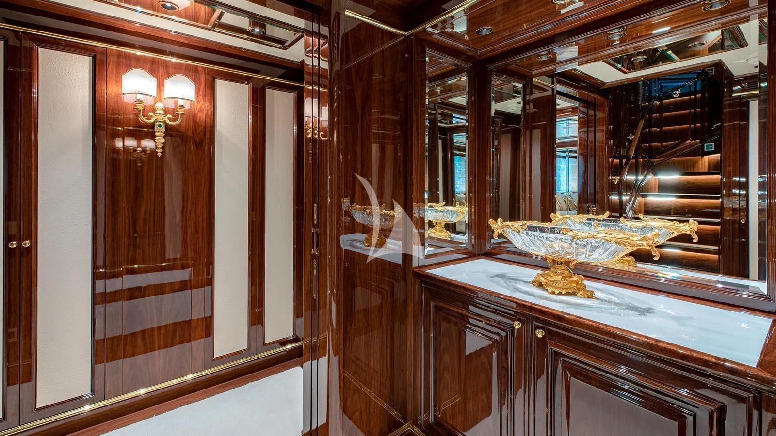 a room with wooden cabinets aboard LADY LENA Yacht for Sale
