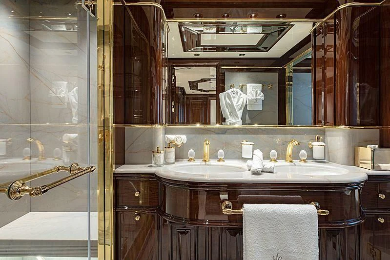 a bathroom with a large mirror aboard LADY LENA Yacht for Sale