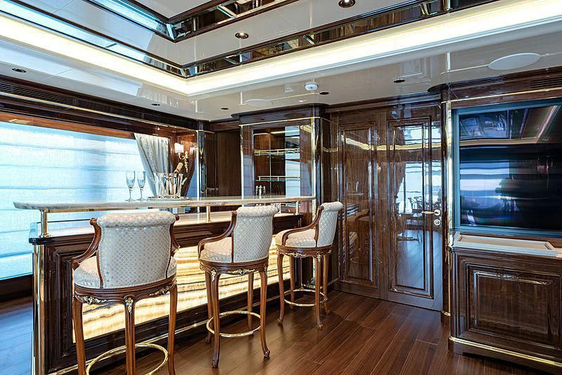 a large room with chairs and a table aboard LADY LENA Yacht for Sale